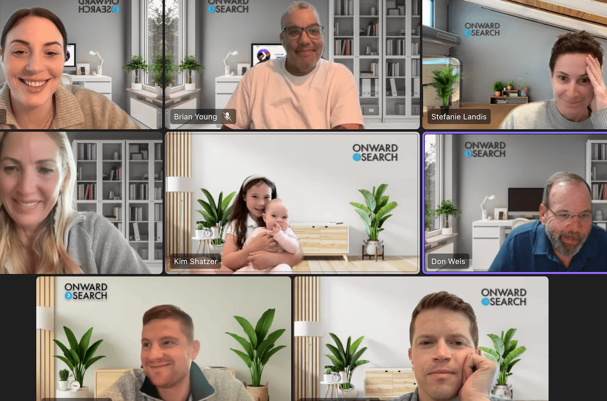 A group of Onward Search team members participate in a virtual meeting with branded backgrounds. The image reflects a connected, flexible workplace culture where employees can collaborate, share personal moments, and feel included from wherever they work.