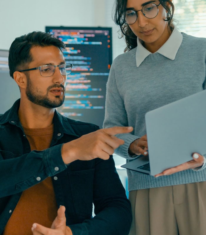 Software engineering team engaged in problem-solving and code analysis for web development in modern office. Software developer, artificial intelligence and programming concept.